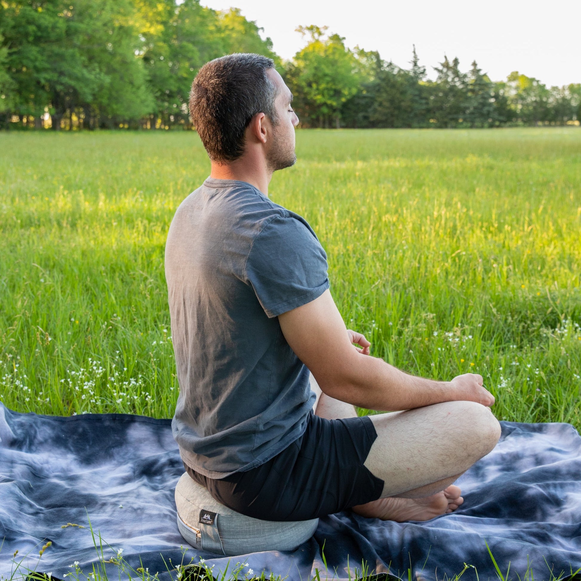 Traditional Meditation Pillow by PineTales being used outside