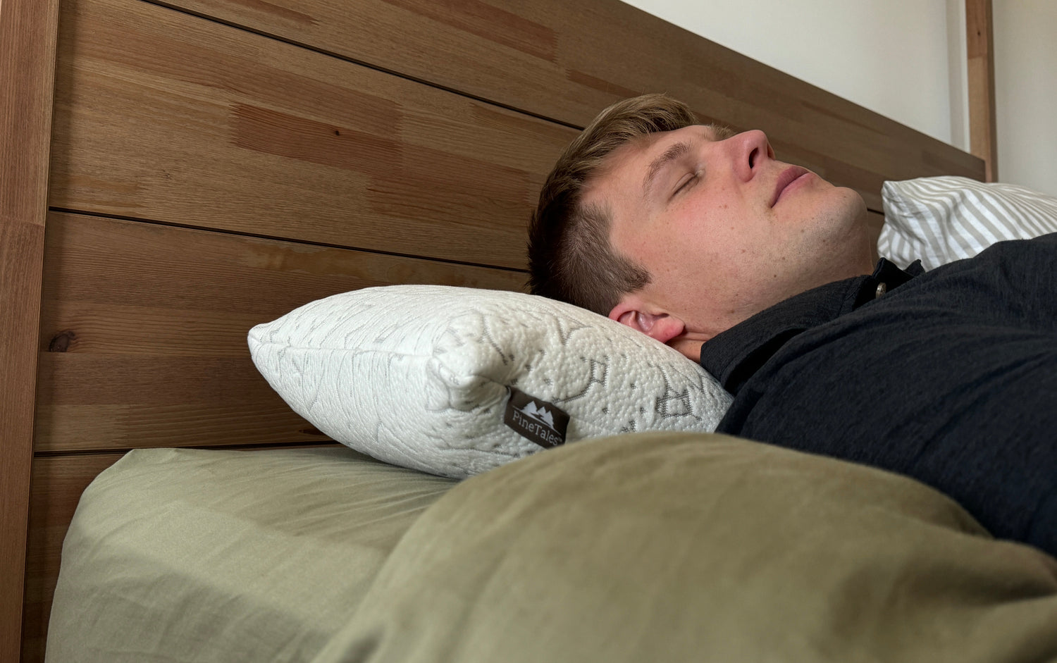 Young Man Sleeping on his back on a Properly Adjusted Buckwheat Pillow